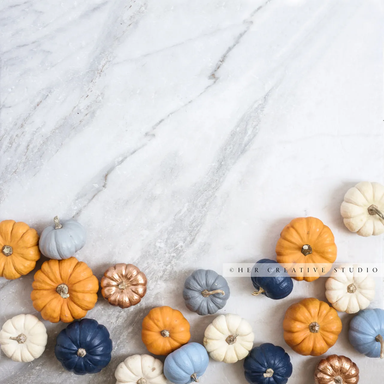 Coloured Pumpkins on Marble