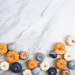 Coloured Pumpkins on Marble