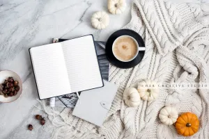 Pumpkins, Notebook & Coffee on Marble